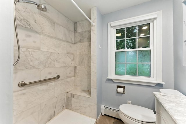 205 Mosier St, South Hadley, MA 01075 - full bathroom with a baseboard heating unit, a tile shower, vanity, and plenty of natural light