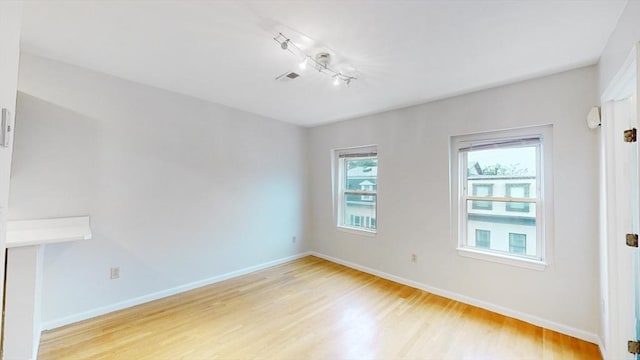 506 E 8th St Unit 3, Boston, MA 02127 - spare room featuring light wood-type flooring, baseboards, and track lighting