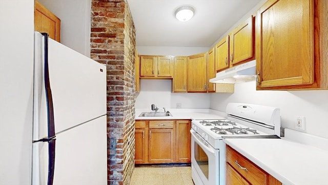 506 E 8th St Unit 3, Boston, MA 02127 - kitchen with white appliances, under cabinet range hood, light countertops, and a sink