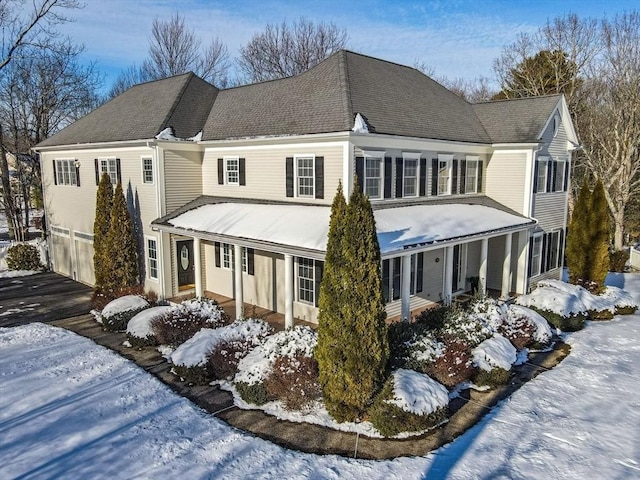 exterior space with a garage and covered porch