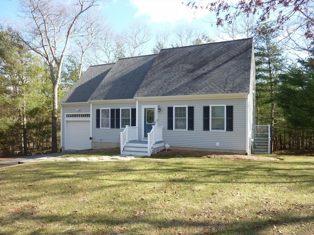 cape cod-style house with an attached garage, roof with shingles, and a front yard