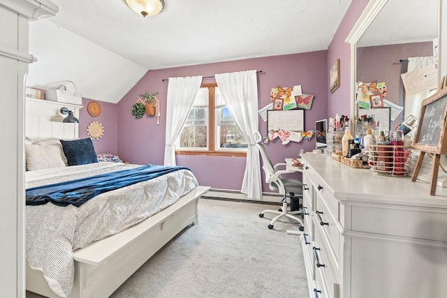 bedroom with baseboard heating, carpet, and vaulted ceiling