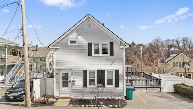 view of front of property featuring a gate, a deck, and fence