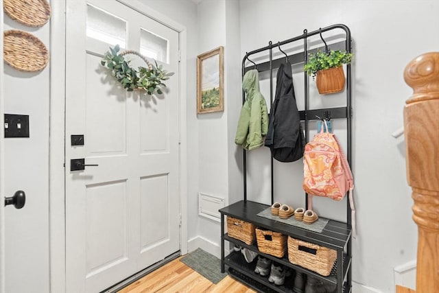 mudroom with light wood finished floors