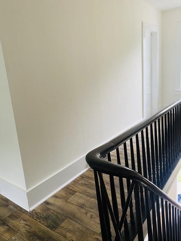 stairway featuring hardwood / wood-style flooring