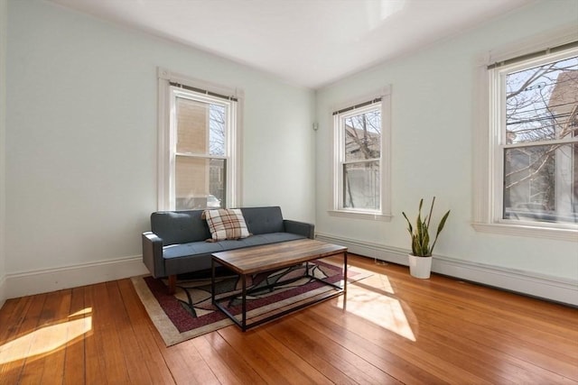 sitting room with light wood-style floors and baseboards