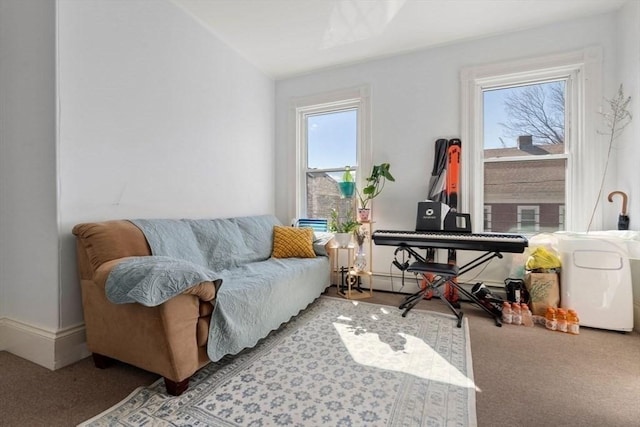 sitting room with carpet and baseboards