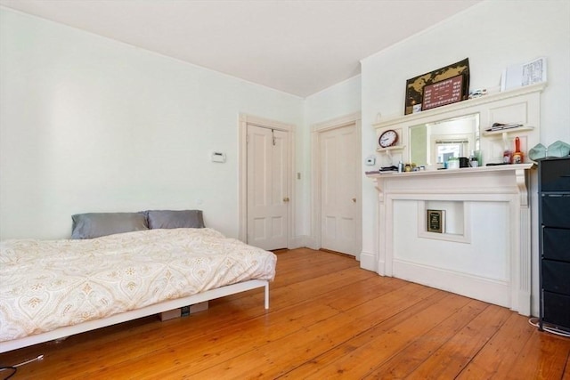 bedroom with light wood finished floors