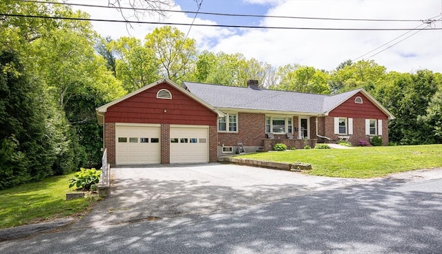 10 Delaney Ave, Dudley, MA 01571 - ranch-style house featuring an attached garage, brick siding, concrete driveway, a chimney, and a front lawn