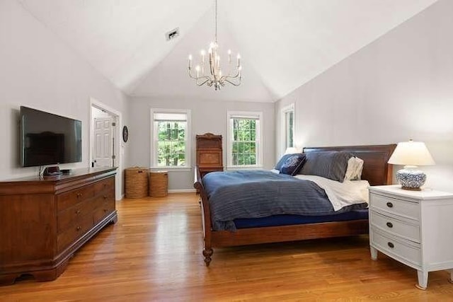 51 Fox Run Rd, Sudbury, MA 01776 - bedroom featuring a chandelier, light wood-style floors, and high vaulted ceiling