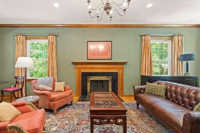 51 Fox Run Rd, Sudbury, MA 01776 - living area with plenty of natural light, a chandelier, wood finished floors, a fireplace with flush hearth, and recessed lighting