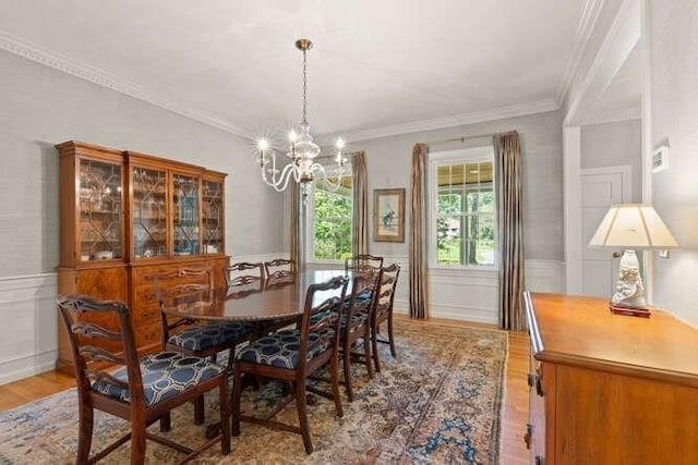51 Fox Run Rd, Sudbury, MA 01776 - dining area with a chandelier, light wood-style floors, ornamental molding, wainscoting, and a decorative wall