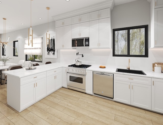 kitchen featuring kitchen peninsula, stainless steel dishwasher, decorative light fixtures, white range with gas stovetop, and black microwave