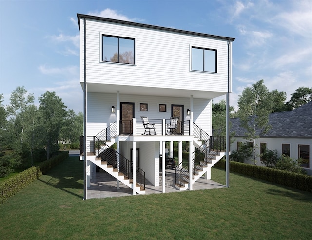 rear view of house with a lawn and a patio area