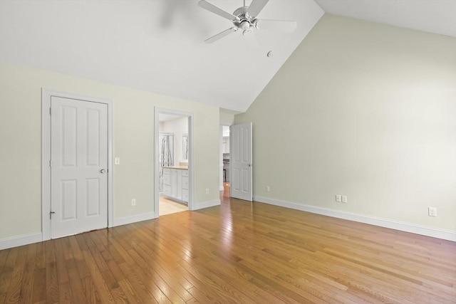 21 Pine St Unit 1A, Falmouth, MA 02556 - unfurnished bedroom featuring light wood-style floors, high vaulted ceiling, ensuite bathroom, and a ceiling fan