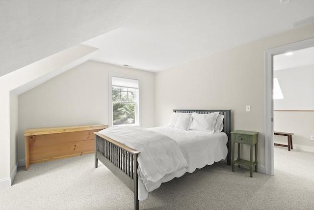 21 Pine St Unit 1A, Falmouth, MA 02556 - carpeted bedroom with vaulted ceiling and baseboards