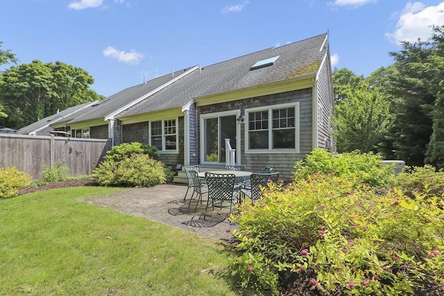 21 Pine St Unit 1A, Falmouth, MA 02556 - back of house with a patio and roof with shingles