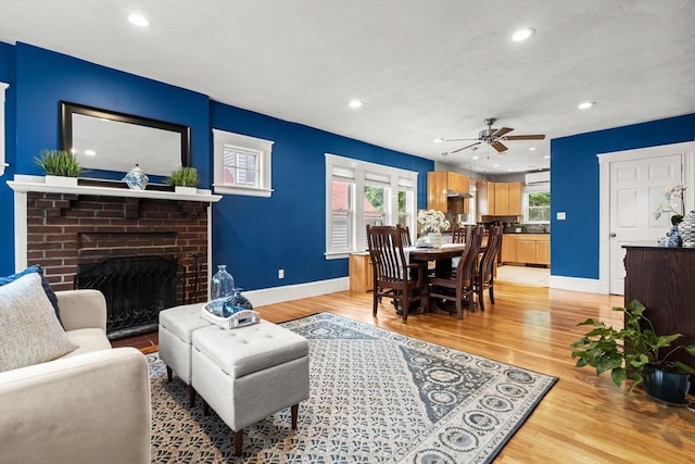 338 Forest St, Arlington, MA 02474 - living area featuring a fireplace, recessed lighting, light wood-style flooring, and a ceiling fan