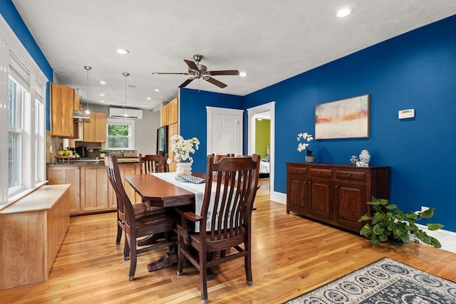 338 Forest St, Arlington, MA 02474 - dining area featuring light wood finished floors, a ceiling fan, a wall mounted air conditioner, and recessed lighting