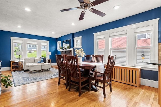 338 Forest St, Arlington, MA 02474 - dining area with light wood-style floors, a ceiling fan, and recessed lighting