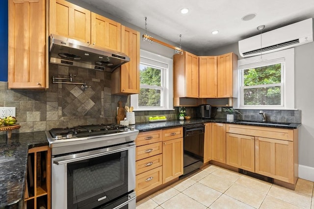 338 Forest St, Arlington, MA 02474 - kitchen with gas stove, black dishwasher, extractor fan, a wall mounted air conditioner, and tasteful backsplash