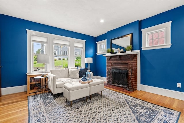 338 Forest St, Arlington, MA 02474 - living area with a fireplace, wood finished floors, and recessed lighting