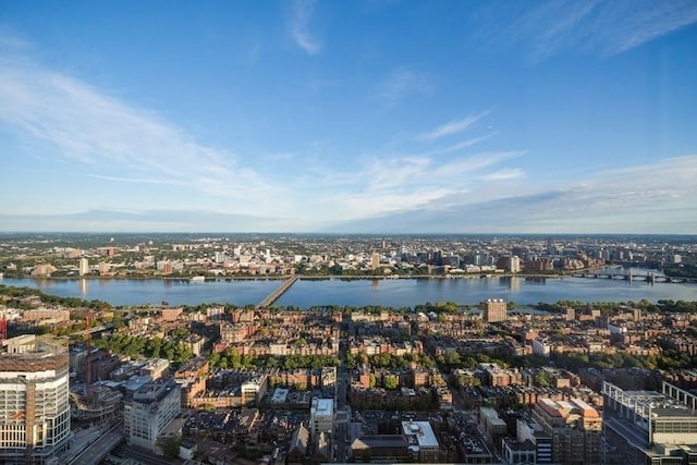 drone / aerial view featuring a water view and a view of city
