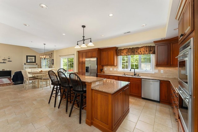 55 Arbor Rd, Uxbridge, MA 01569 - kitchen featuring stainless steel appliances, a sink, plenty of natural light, tasteful backsplash, and recessed lighting