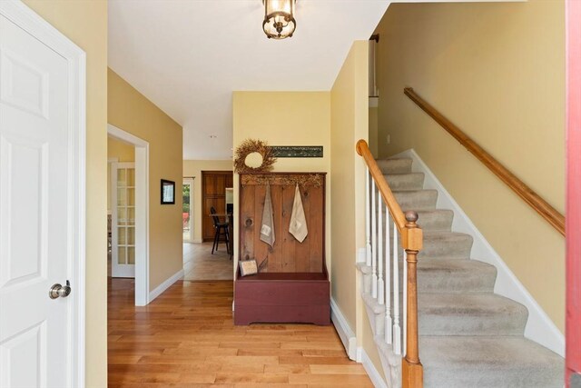 55 Arbor Rd, Uxbridge, MA 01569 - entrance foyer featuring stairway, light wood-style floors, and baseboards
