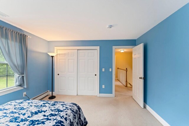 55 Arbor Rd, Uxbridge, MA 01569 - bedroom featuring baseboard heating, carpet, baseboards, and a closet