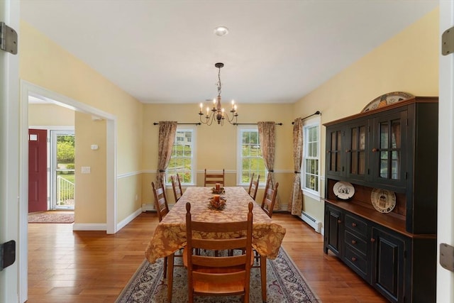 55 Arbor Rd, Uxbridge, MA 01569 - dining room featuring a chandelier, wood finished floors, and plenty of natural light