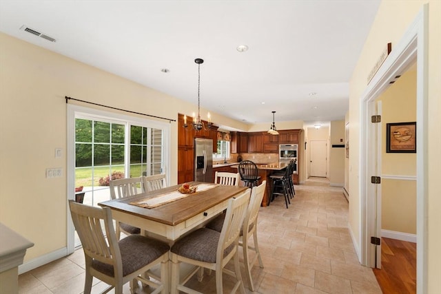55 Arbor Rd, Uxbridge, MA 01569 - dining space with baseboards, recessed lighting, and light stone finish flooring