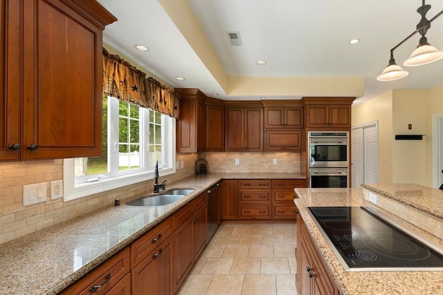 55 Arbor Rd, Uxbridge, MA 01569 - kitchen featuring a sink, stainless steel appliances, brown cabinets, and recessed lighting
