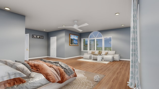 living room with hardwood / wood-style floors and ceiling fan