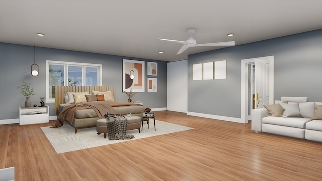 bedroom with ceiling fan, light wood-type flooring, and multiple windows