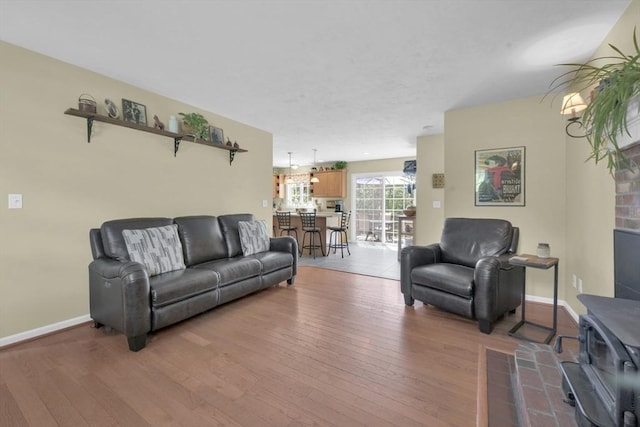 42 Mcgregory Rd, Sturbridge, MA 01566 - living area with hardwood / wood-style floors and a wood stove