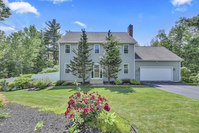 42 Mcgregory Rd, Sturbridge, MA 01566 - colonial house featuring a chimney, asphalt driveway, an attached garage, and entry steps
