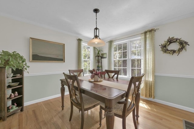 42 Mcgregory Rd, Sturbridge, MA 01566 - dining area featuring light wood-type flooring and crown molding