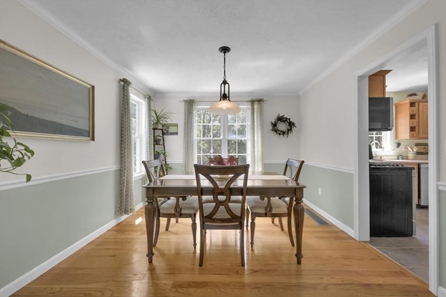 42 Mcgregory Rd, Sturbridge, MA 01566 - dining room featuring light wood-style flooring and ornamental molding