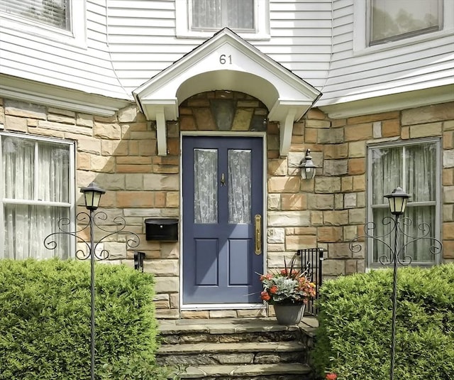 view of exterior entry with stone siding