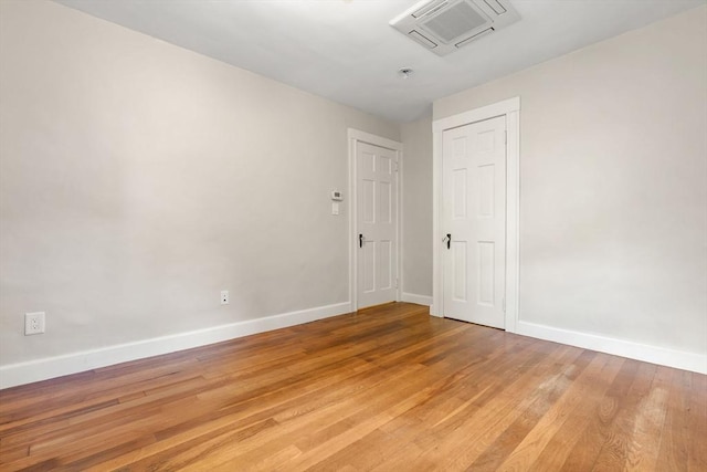 46 Leonard St, Woburn, MA 01801 - spare room with baseboards, light wood finished floors, and a pendent fire sprinkler