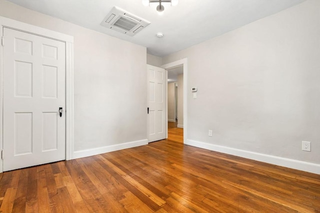 46 Leonard St, Woburn, MA 01801 - unfurnished bedroom featuring baseboards and wood finished floors