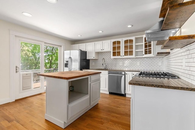 46 Leonard St, Woburn, MA 01801 - kitchen with open shelves, appliances with stainless steel finishes, wooden counters, white cabinetry, and decorative backsplash