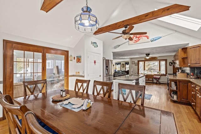 125 Wamsutta Rd, Eastham, MA 02642 - dining room with a ceiling fan, light wood-style flooring, beam ceiling, and high vaulted ceiling