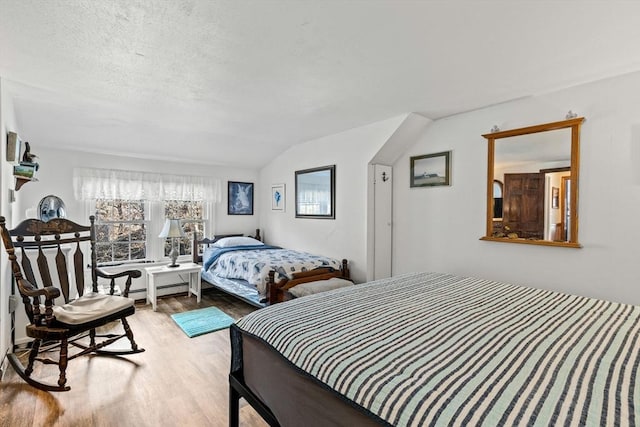 125 Wamsutta Rd, Eastham, MA 02642 - bedroom featuring light wood finished floors and vaulted ceiling