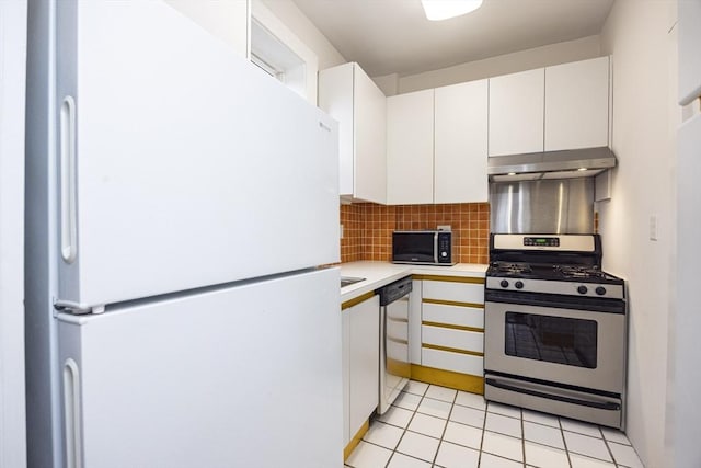 34 Garrison Rd Unit 4, Brookline, MA 02445 - kitchen featuring stainless steel appliances, under cabinet range hood, light countertops, decorative backsplash, and white cabinetry