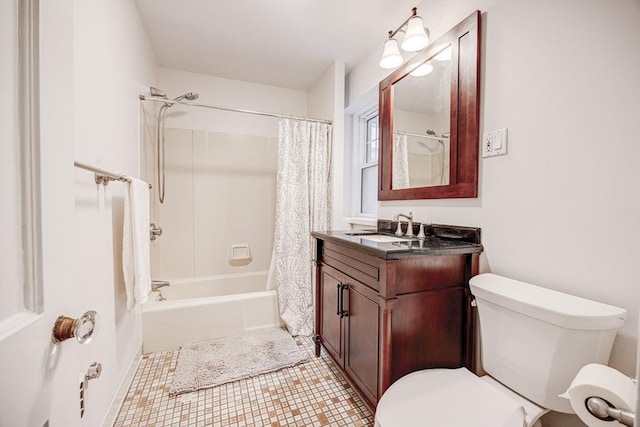34 Garrison Rd Unit 4, Brookline, MA 02445 - full bath featuring toilet, vanity, tile patterned flooring, and shower / tub combo