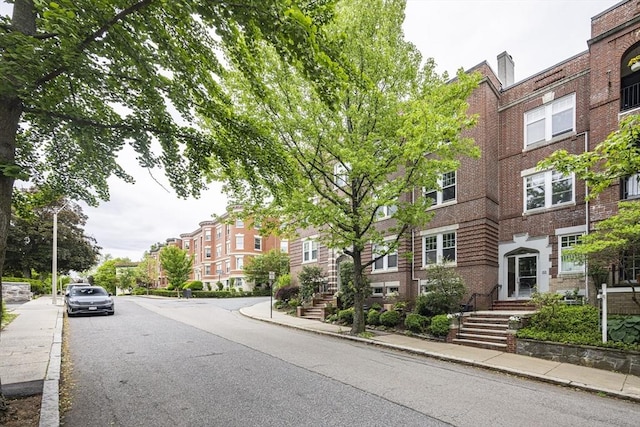 34 Garrison Rd Unit 4, Brookline, MA 02445 - view of asphalt road with sidewalks, curbs, and street lighting