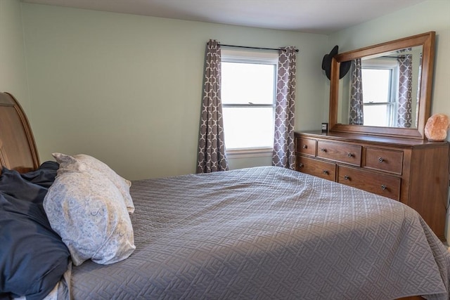 bedroom featuring multiple windows