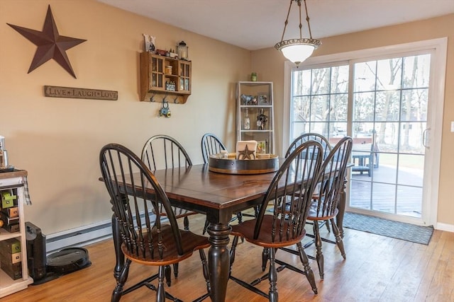 dining space with light wood-type flooring